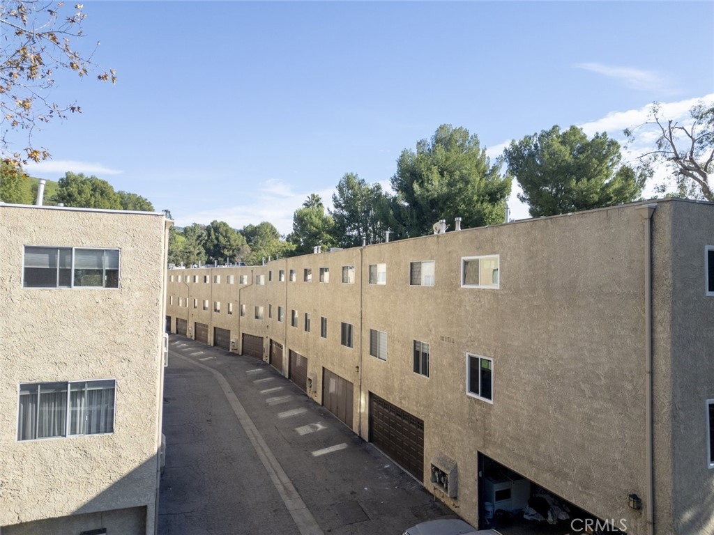 9775 Vía Roma Burbank, CA 91504 - Photo 36 of 39 a view of a white house with iron fence