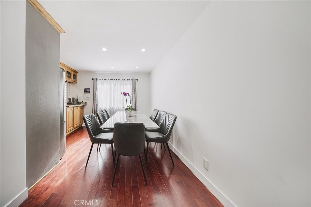 9775 Vía Roma Burbank, CA 91504 - Photo 4 of 39 a view of a dining room with furniture and wooden floor