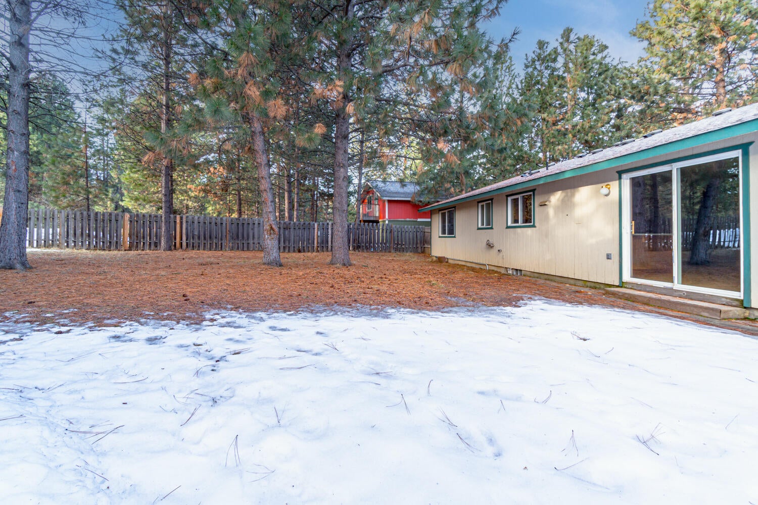 19291 Indian Summer Road Bend, OR 97702 - Photo 30 of 41 Concrete patio off the sliding glass door. Plenty of space to make this backyard a private oasis.