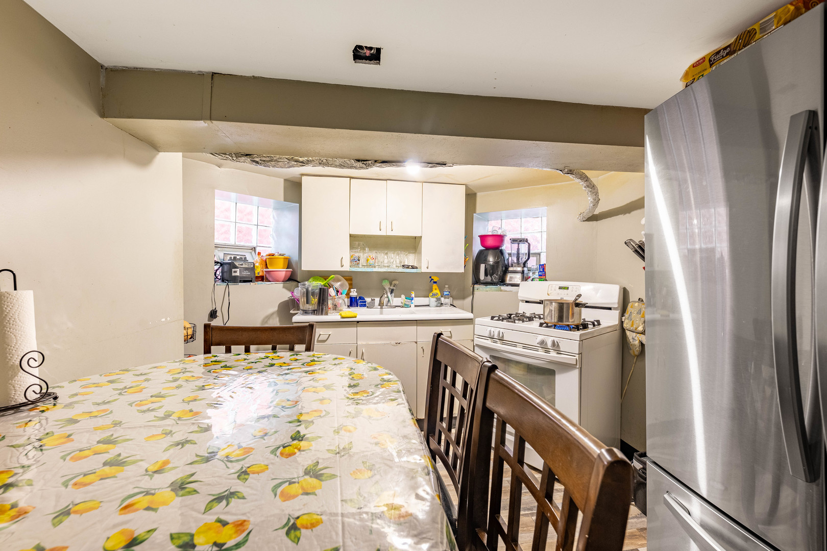 2434 South Harding Avenue Chicago, IL 60623 - Photo 12 of 21 a kitchen with stainless steel appliances granite countertop a sink refrigerator and microwave