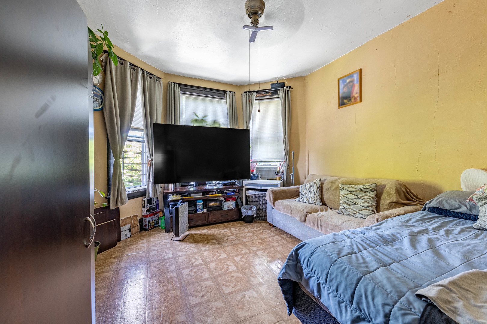 2434 South Harding Avenue Chicago, IL 60623 - Photo 8 of 21 a living room with furniture and a flat screen tv