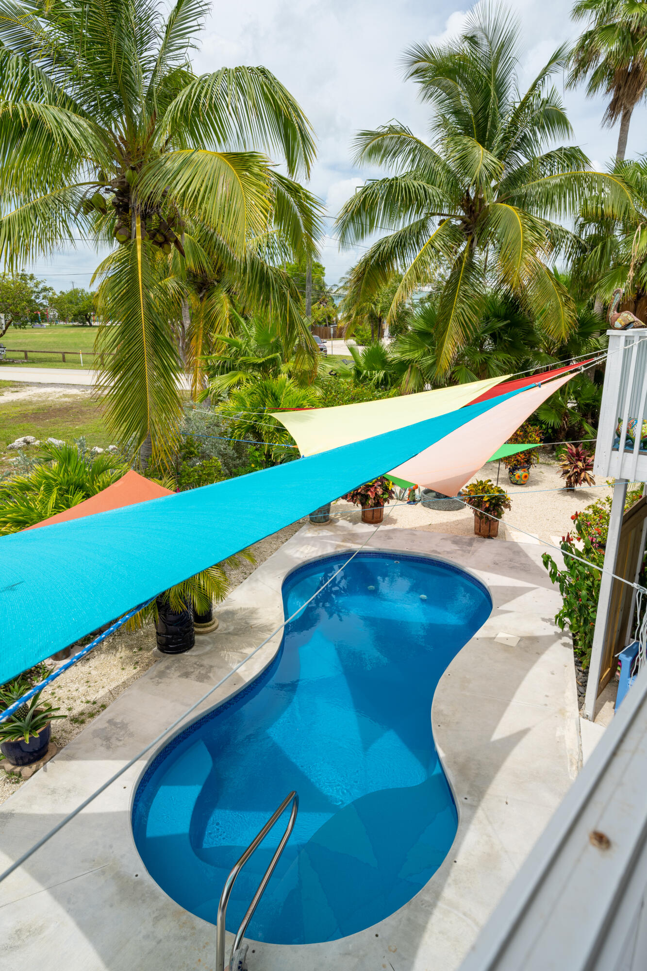 18 West Circle Drive Key West, FL 33040 - Photo 13 of 30 a view of a swimming pool with a yard