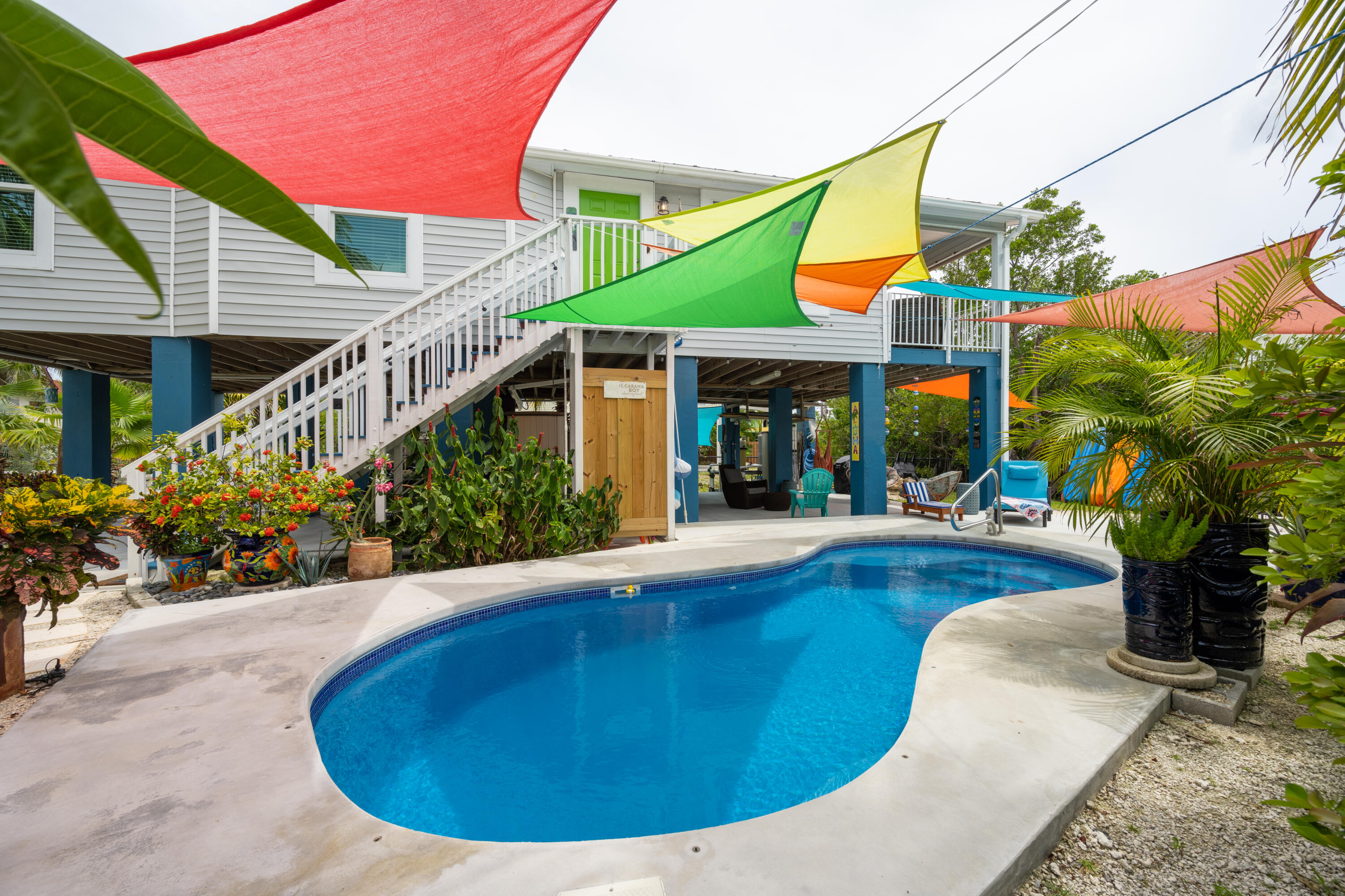 18 West Circle Drive Key West, FL 33040 - Photo 24 of 30 a view of a house with sitting area and potted plants