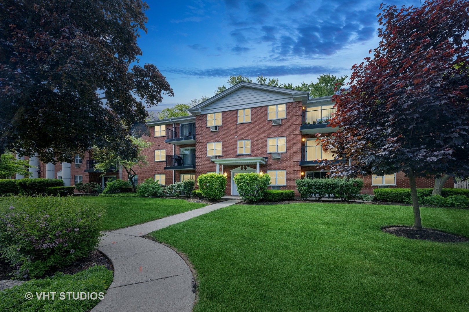 801 East Miner Street, Unit 1A Arlington Heights, IL 60004 - Photo 1 of 21 a front view of a house with a yard
