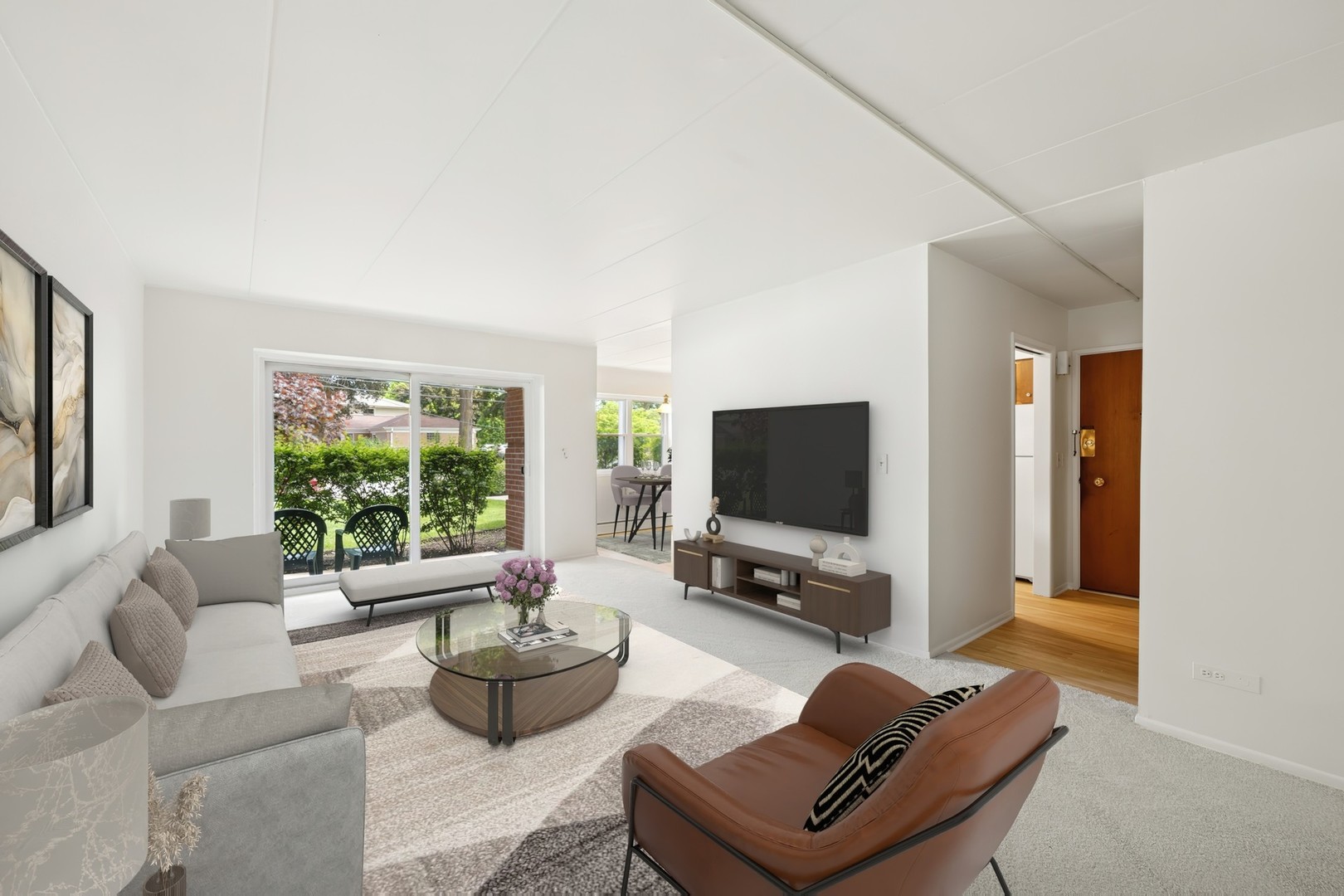 801 East Miner Street, Unit 1A Arlington Heights, IL 60004 - Photo 2 of 21 a living room with furniture a flat screen tv and a window