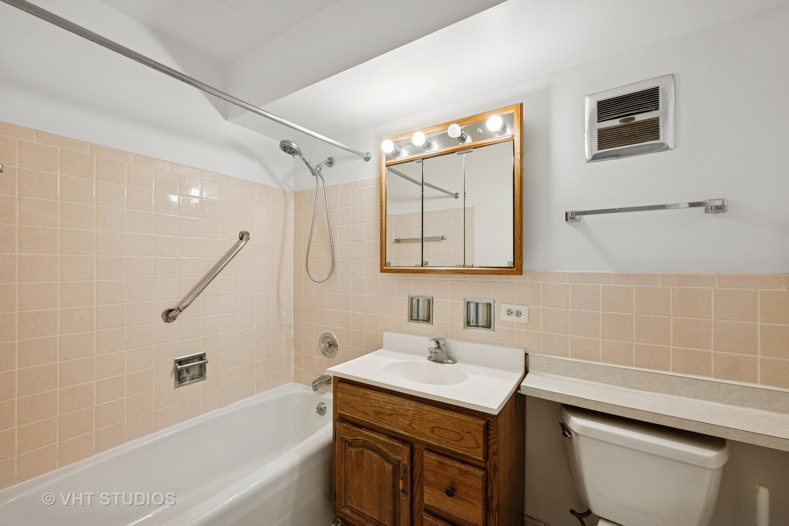 801 East Miner Street, Unit 1A Arlington Heights, IL 60004 - Photo 6 of 21 a bathroom with a sink a toilet and shower