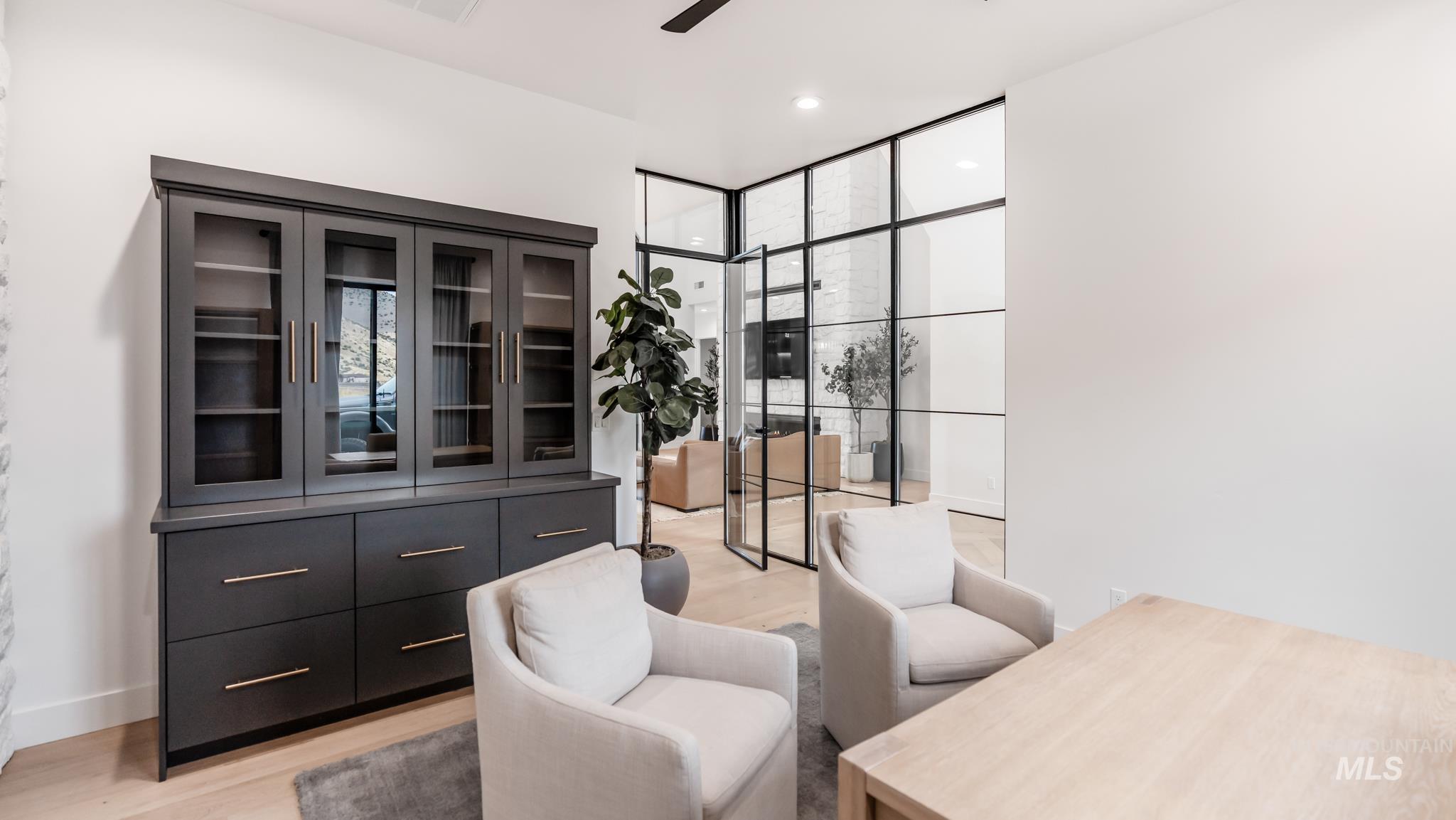 6162 North High Valley Way Boise, ID 83714 - Photo 13 of 50 Living area with light wood-style flooring, expansive windows, recessed lighting, and ceiling fan