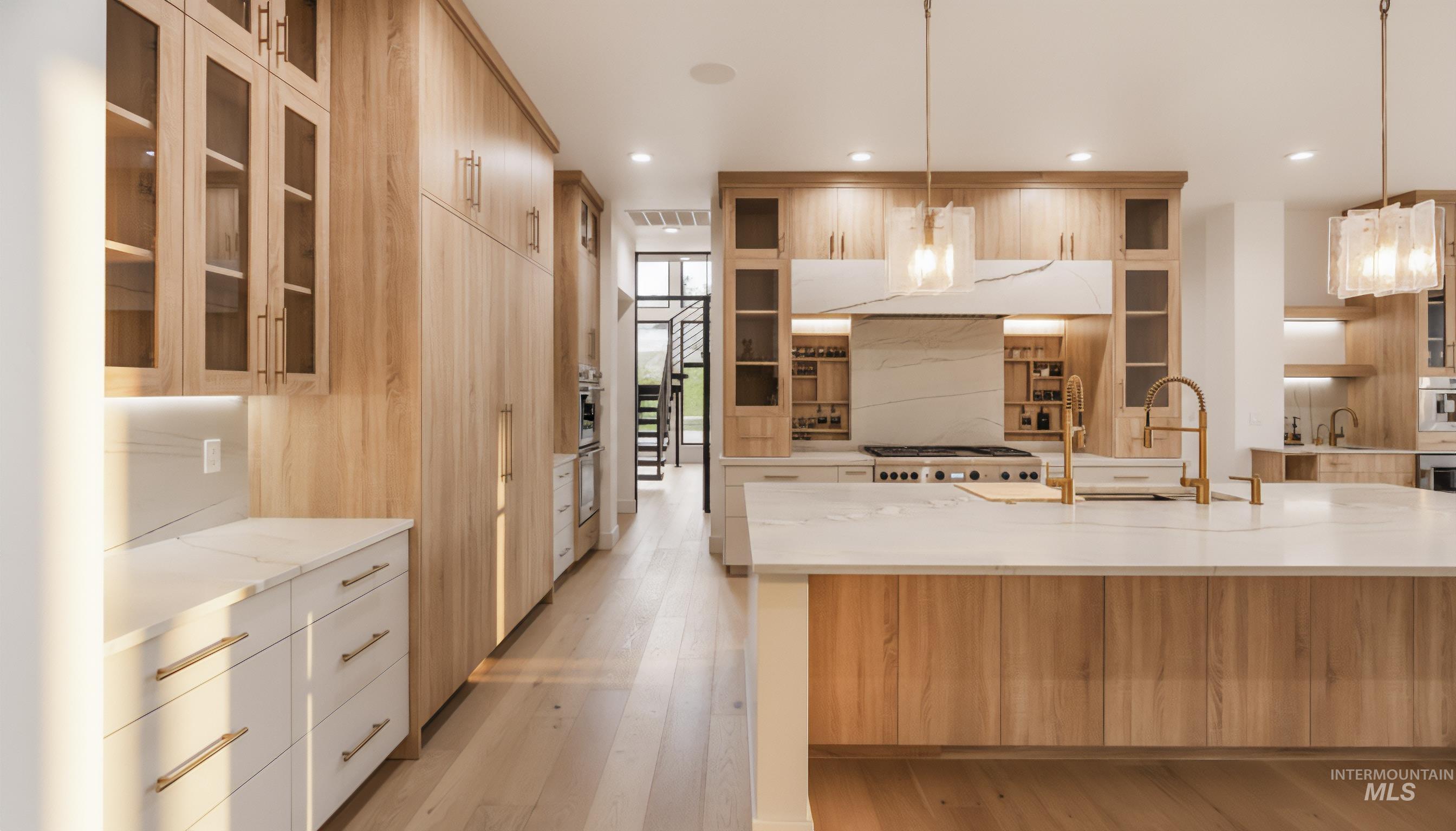 6162 North High Valley Way Boise, ID 83714 - Photo 16 of 50 Kitchen with glass insert cabinets, light stone countertops, pendant lighting, modern cabinets, and recessed lighting