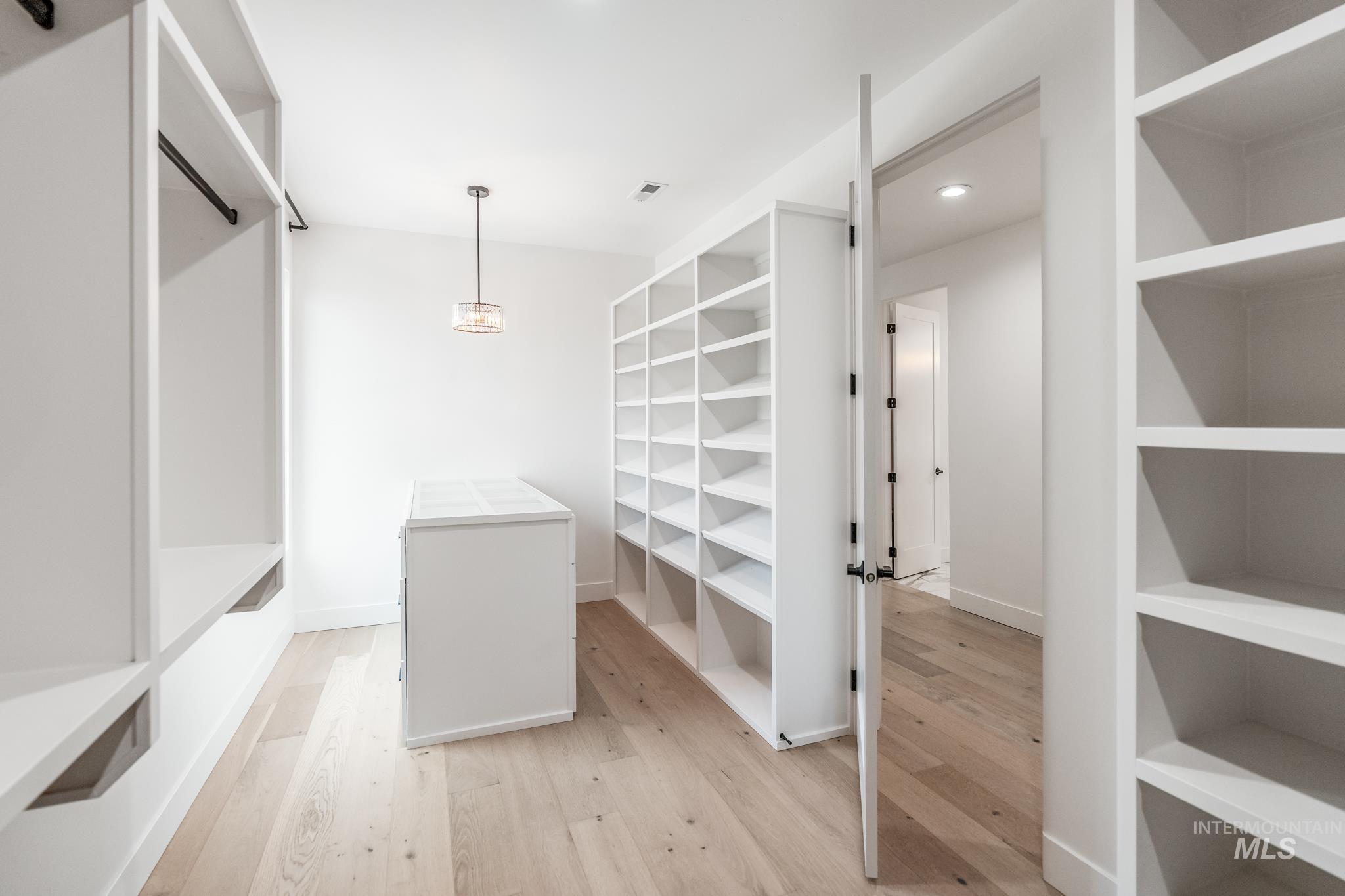 6162 North High Valley Way Boise, ID 83714 - Photo 37 of 50 Walk in closet with light wood-type flooring