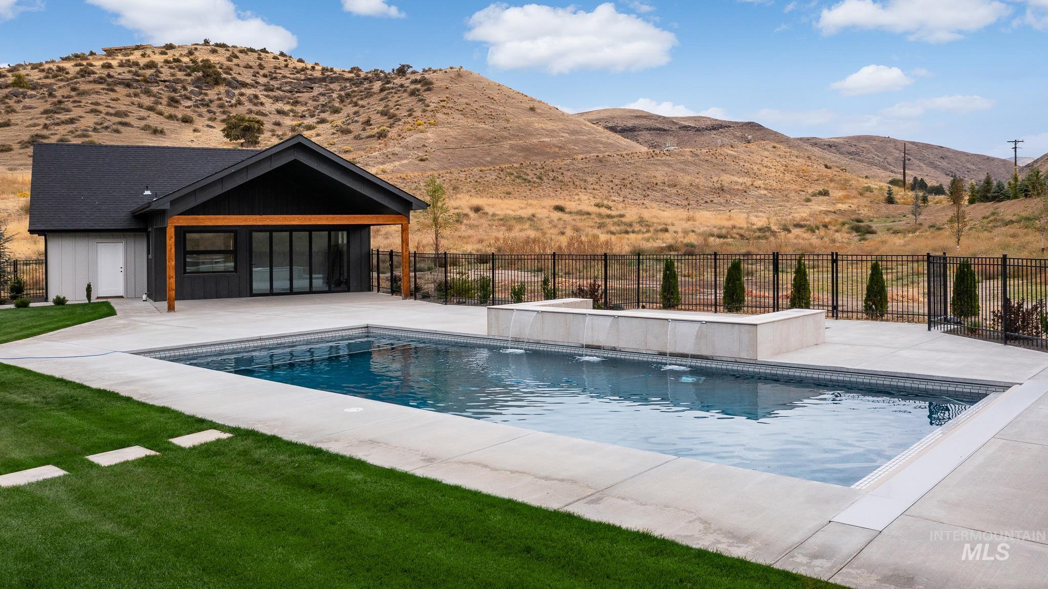 6162 North High Valley Way Boise, ID 83714 - Photo 6 of 50 View of swimming pool with a patio and a mountain view