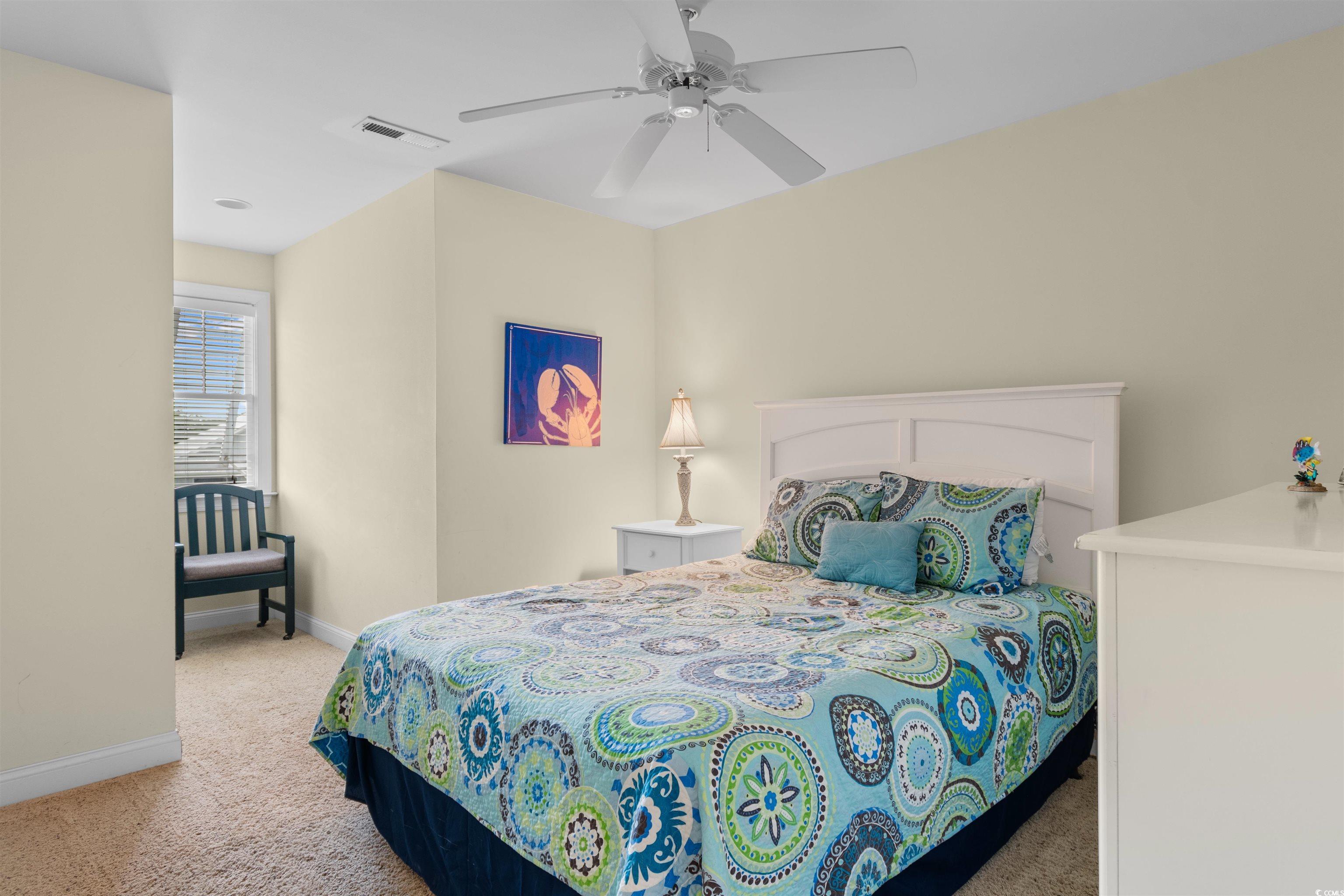 141 Cayman Loop Pawleys Island, SC 29585 - Photo 21 of 40 Bedroom featuring light colored carpet, baseboards, and ceiling fan