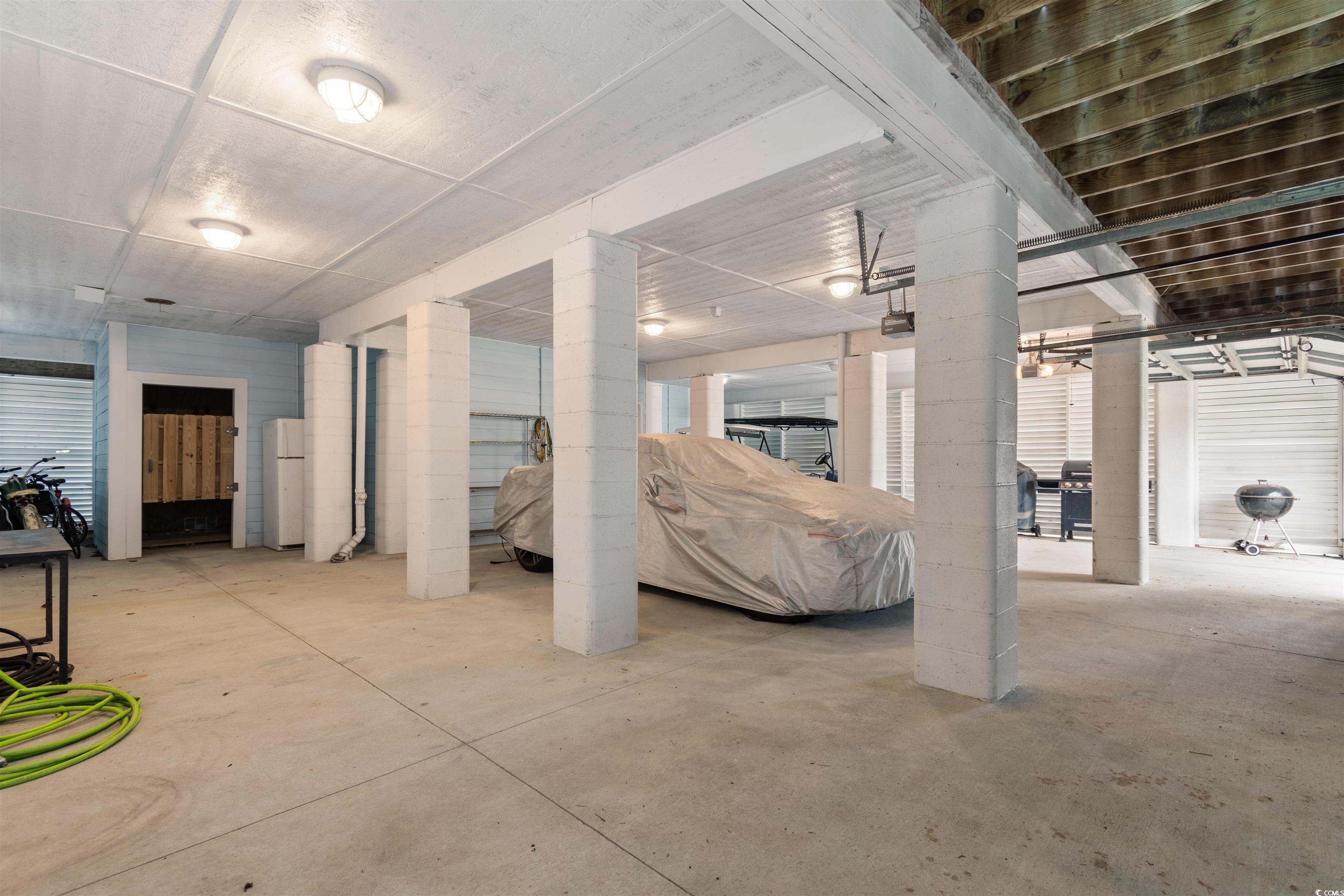 141 Cayman Loop Pawleys Island, SC 29585 - Photo 35 of 40 Below grade area featuring freestanding refrigerator