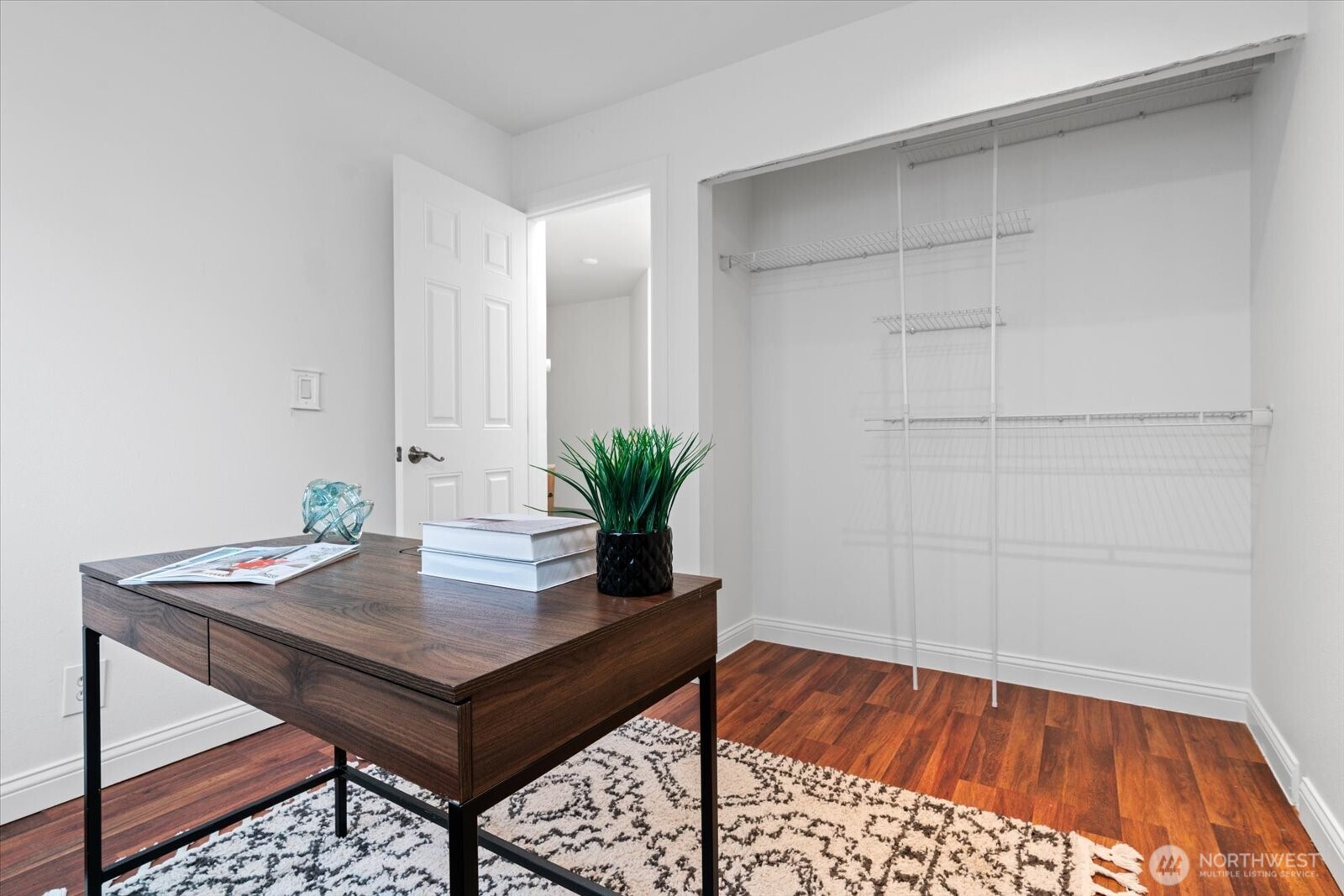 1600 East Yesler Way, Unit 102 Seattle, WA 98122 - Photo 20 of 23 a workspace with furniture and wooden floor