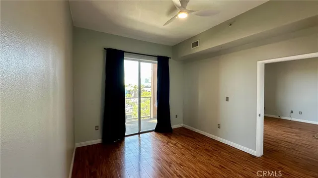 a bedroom with a bed and a lamp