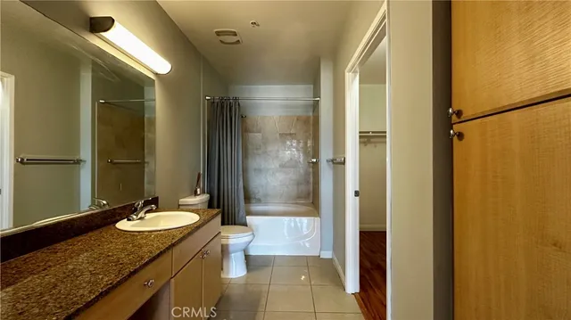 a view of closet with wooden floor