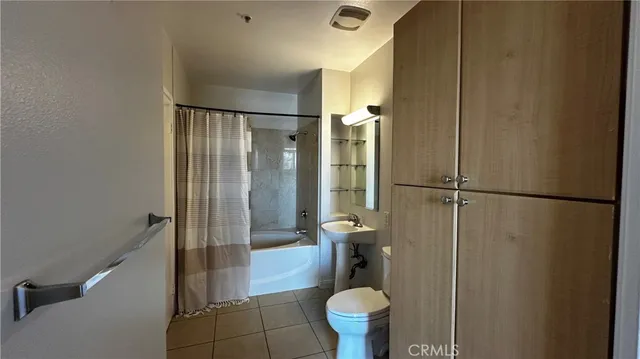 a view of walk in closet with wooden floor
