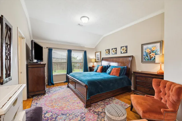 a kitchen with stainless steel appliances kitchen island granite countertop a refrigerator a stove a sink dishwasher and a dining table with wooden floor