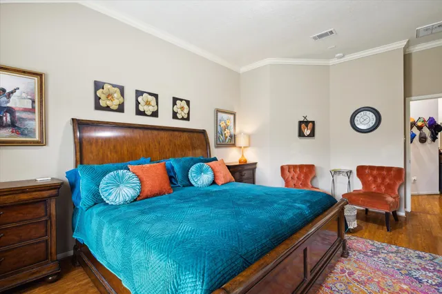 a bedroom with a bed and a couch