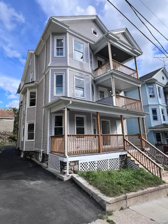 a front view of a house with a fence