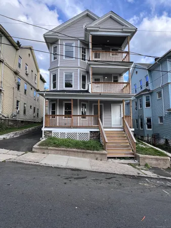 a front view of residential houses with street