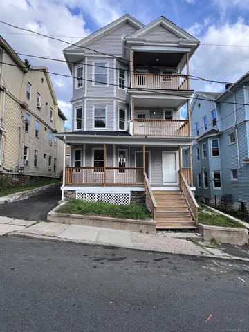 a front view of residential houses with street