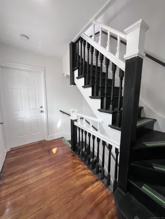 a view of entryway with wooden floor
