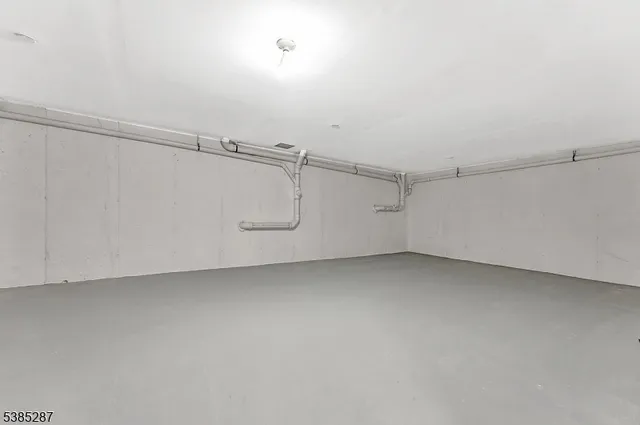 a view of a utility room with racks on the wall