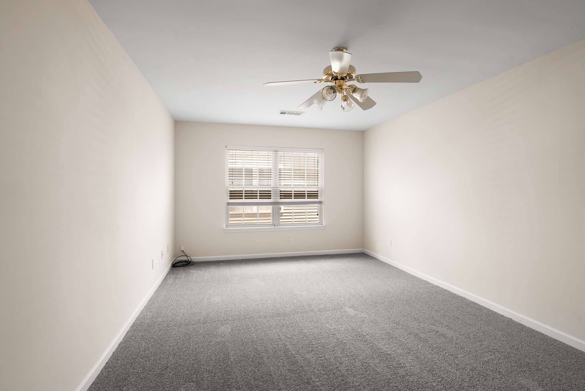 1101 Downs Boulevard, Unit 112 Franklin, TN 37064 - Photo 16 of 35 an empty room with windows and fan