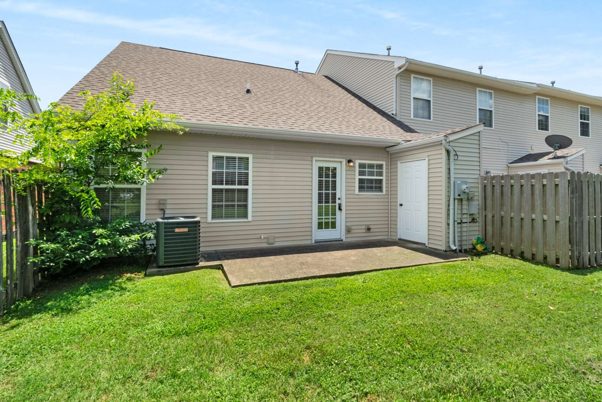 1101 Downs Boulevard, Unit 112 Franklin, TN 37064 - Photo 23 of 35 a front view of a house with a yard and porch