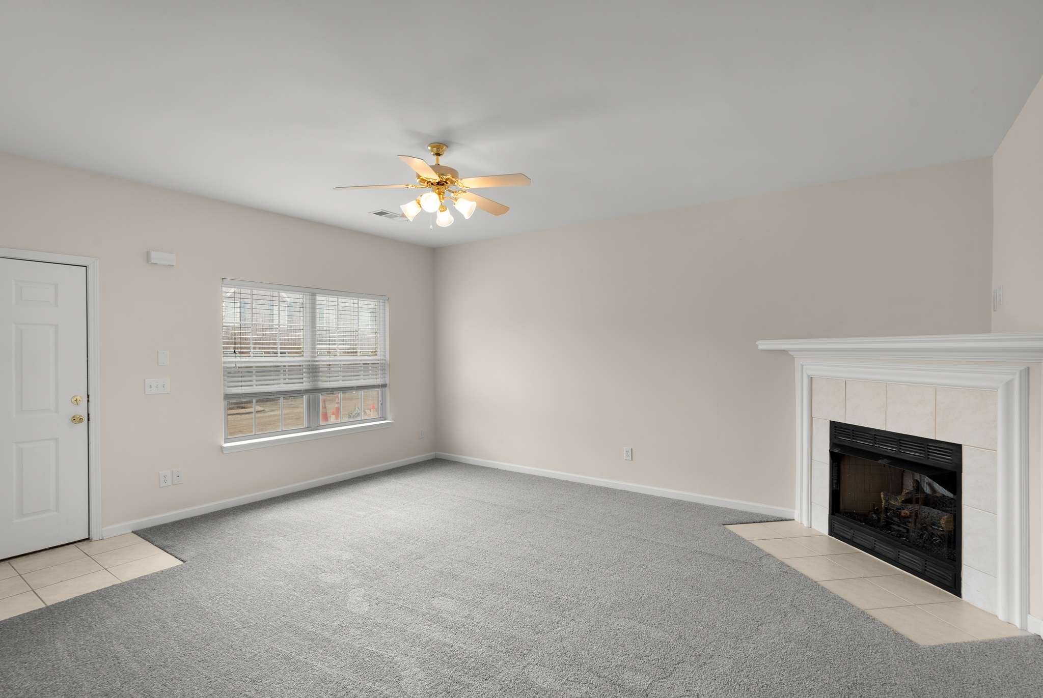 1101 Downs Boulevard, Unit 112 Franklin, TN 37064 - Photo 4 of 35 an empty room with windows and fireplace