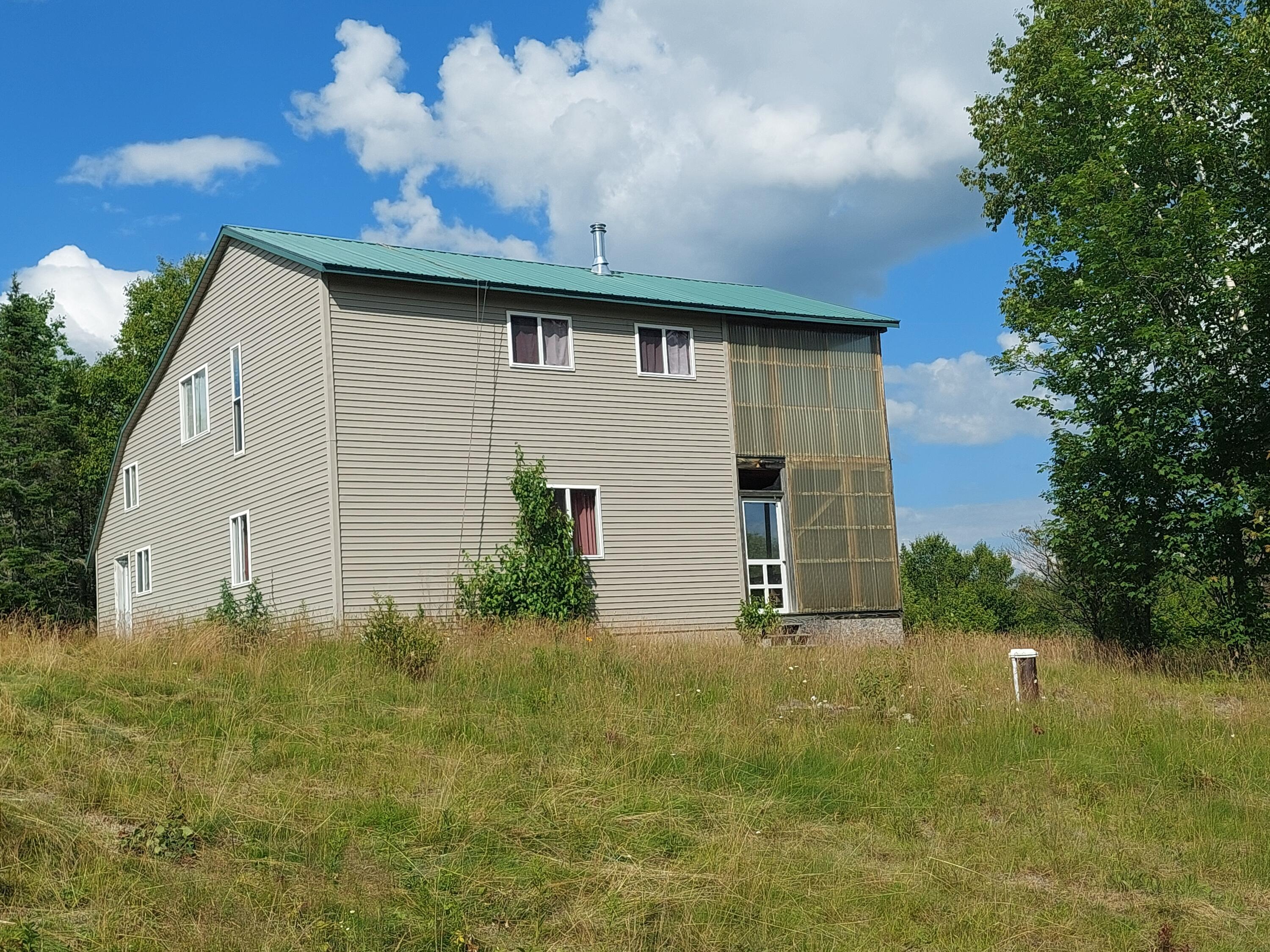 731 Kennebago Road Rangeley, ME 04970 - Photo 4 of 30 side of house and drilled well