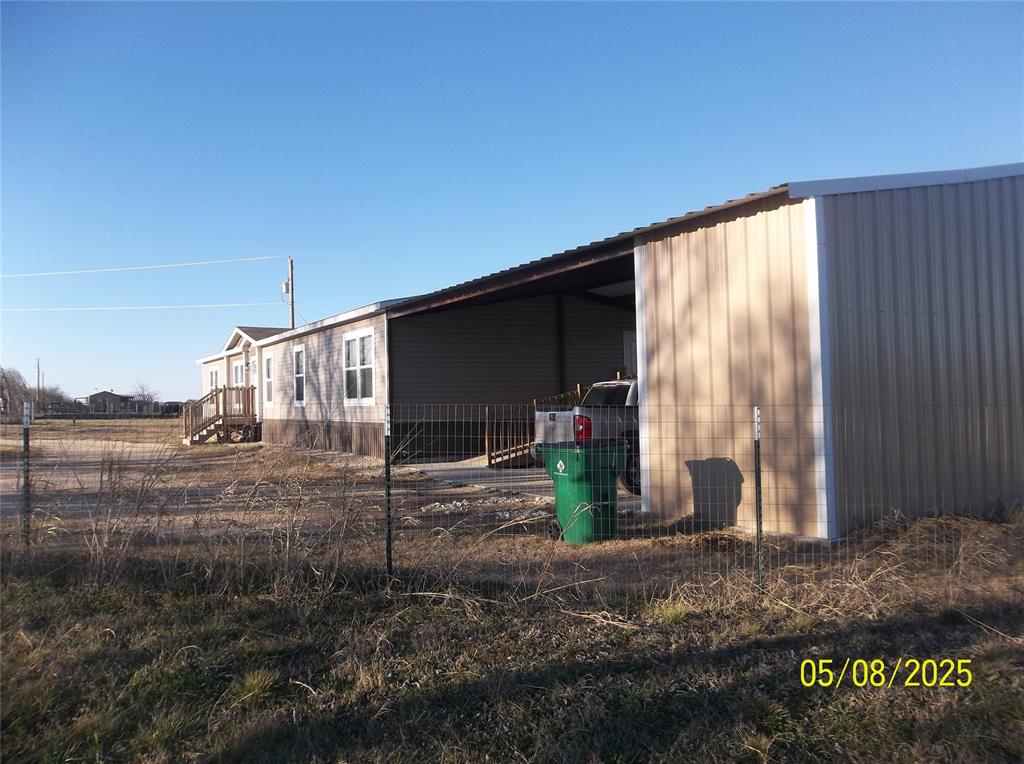 531 Blair Road Waxahachie, TX 75165 - Photo 3 of 40 View of side of home featuring an outdoor structure and a pole building
