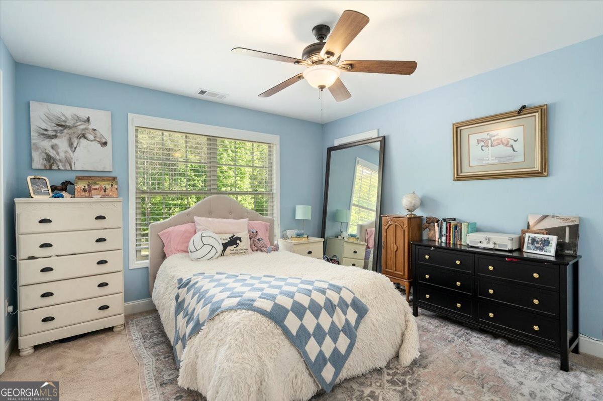 3093 Surry Ridge Drive Watkinsville, GA 30677 - Photo 29 of 41 a bedroom with a bed and a closet