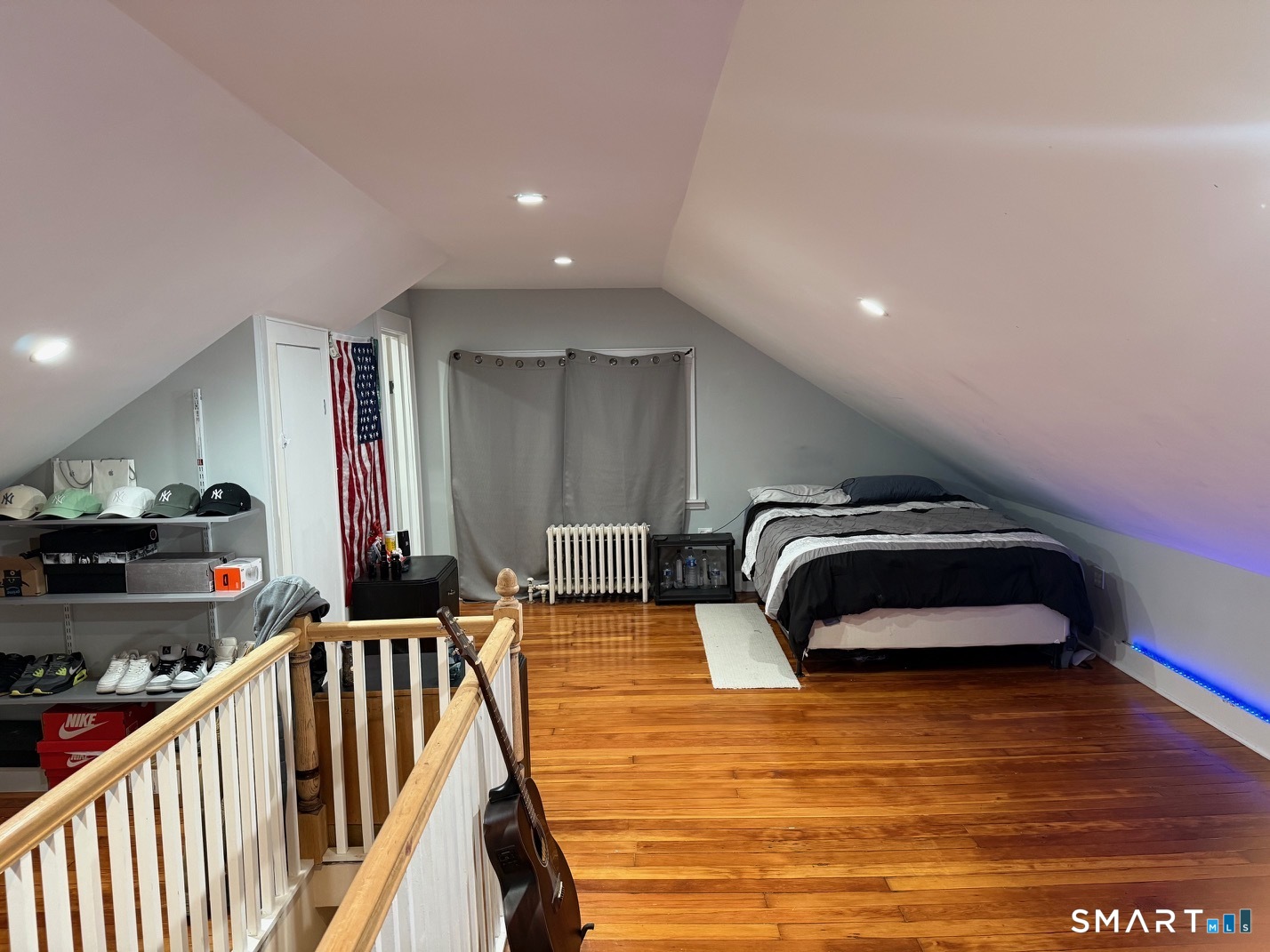 3461 East Main Street Bridgeport, CT 06606 - Photo 29 of 40 a bedroom with furniture and a wooden floor
