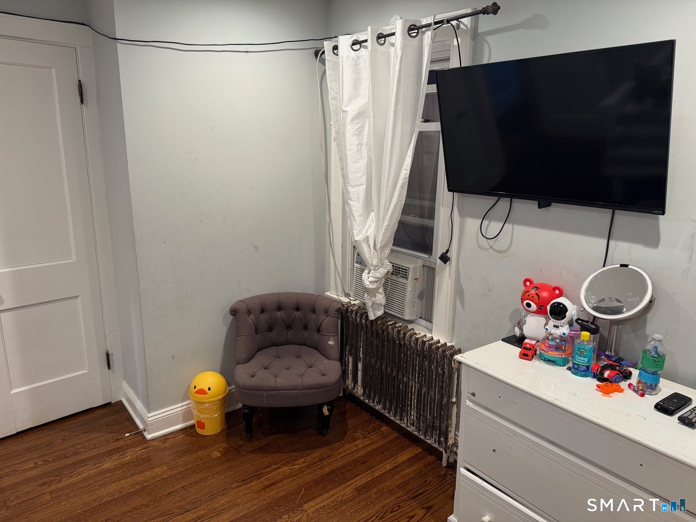 3461 East Main Street Bridgeport, CT 06606 - Photo 31 of 40 a living room with furniture and a flat screen tv