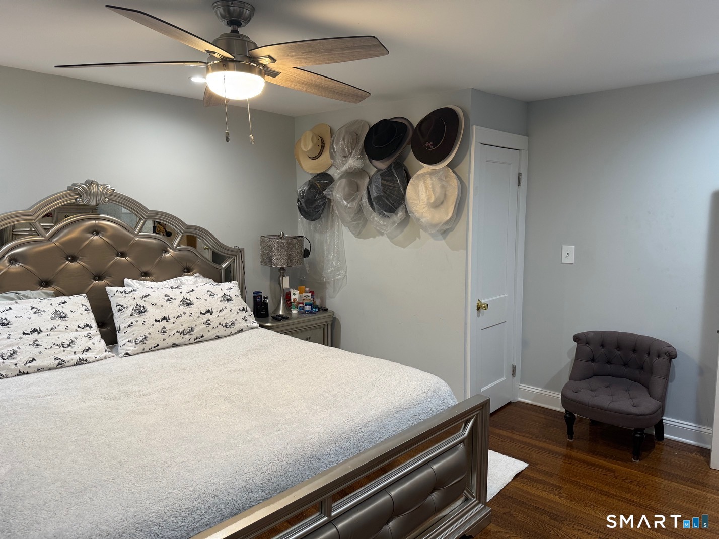 3461 East Main Street Bridgeport, CT 06606 - Photo 36 of 40 a bedroom with a bed and a chandelier