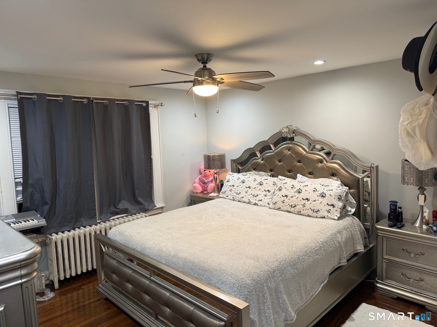 3461 East Main Street Bridgeport, CT 06606 - Photo 37 of 40 a bedroom with a bed and a chandelier