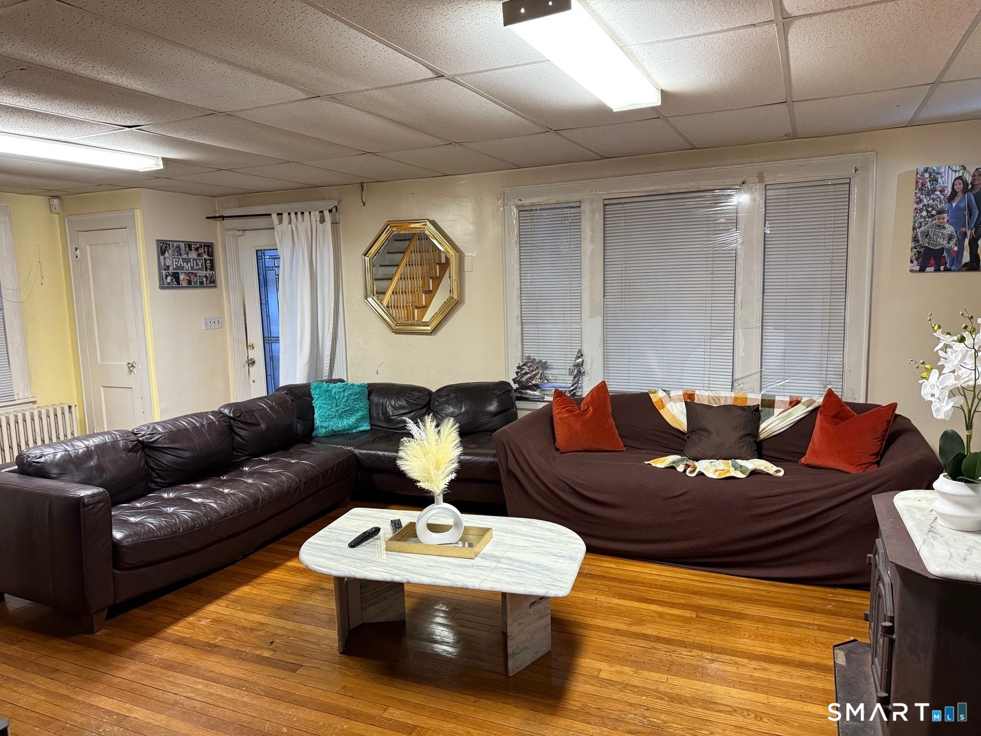 3461 East Main Street Bridgeport, CT 06606 - Photo 39 of 40 a living room with furniture and a wooden floor