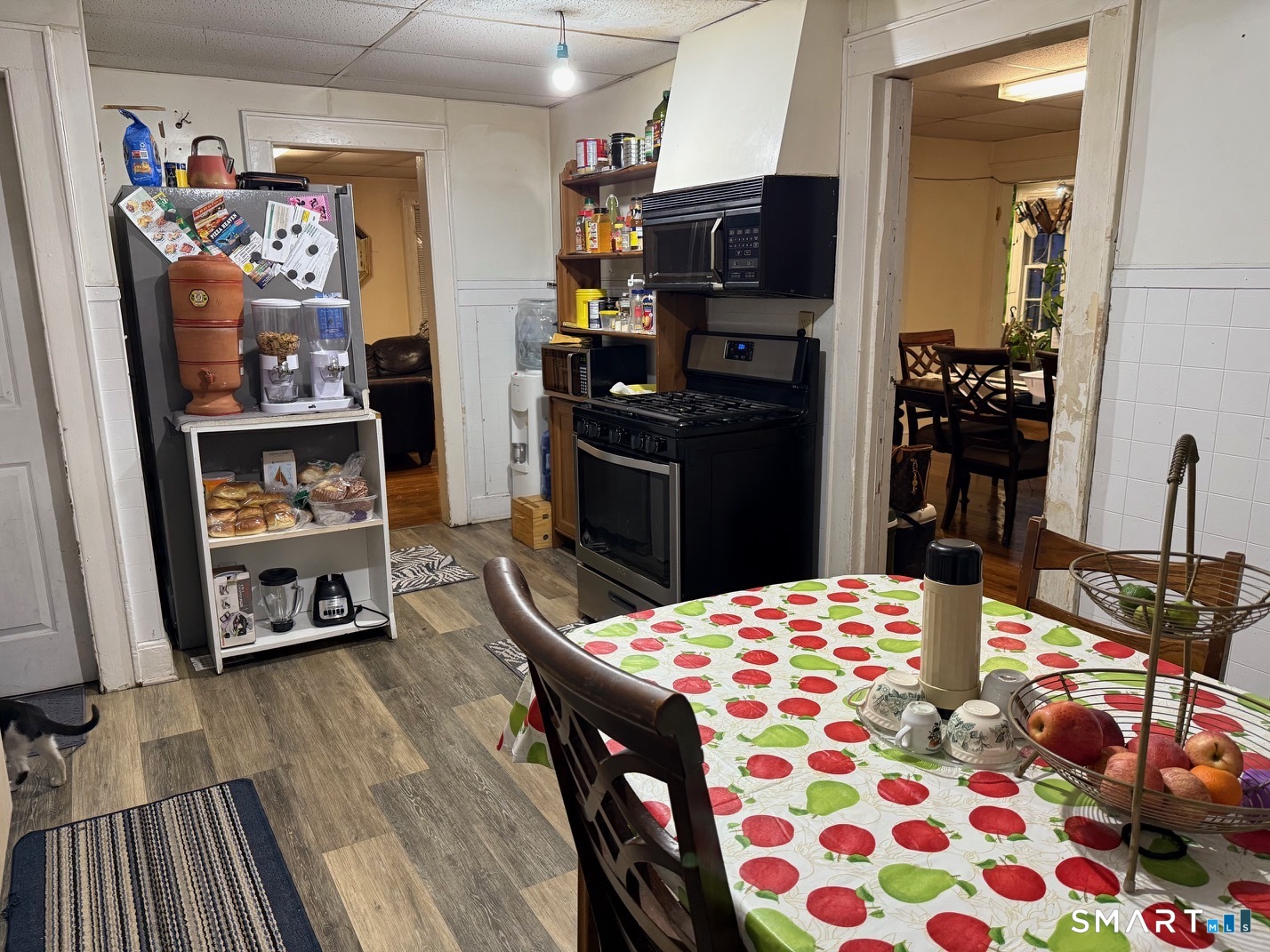 3461 East Main Street Bridgeport, CT 06606 - Photo 5 of 40 a kitchen with stainless steel appliances kitchen island granite countertop a refrigerator and a stove