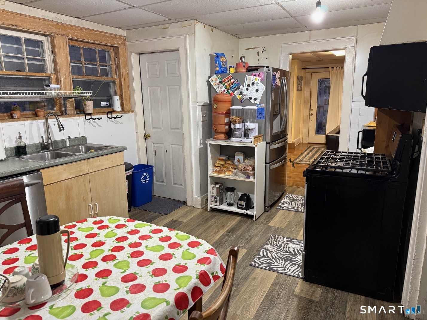 3461 East Main Street Bridgeport, CT 06606 - Photo 6 of 40 a bed room with a bed and a television