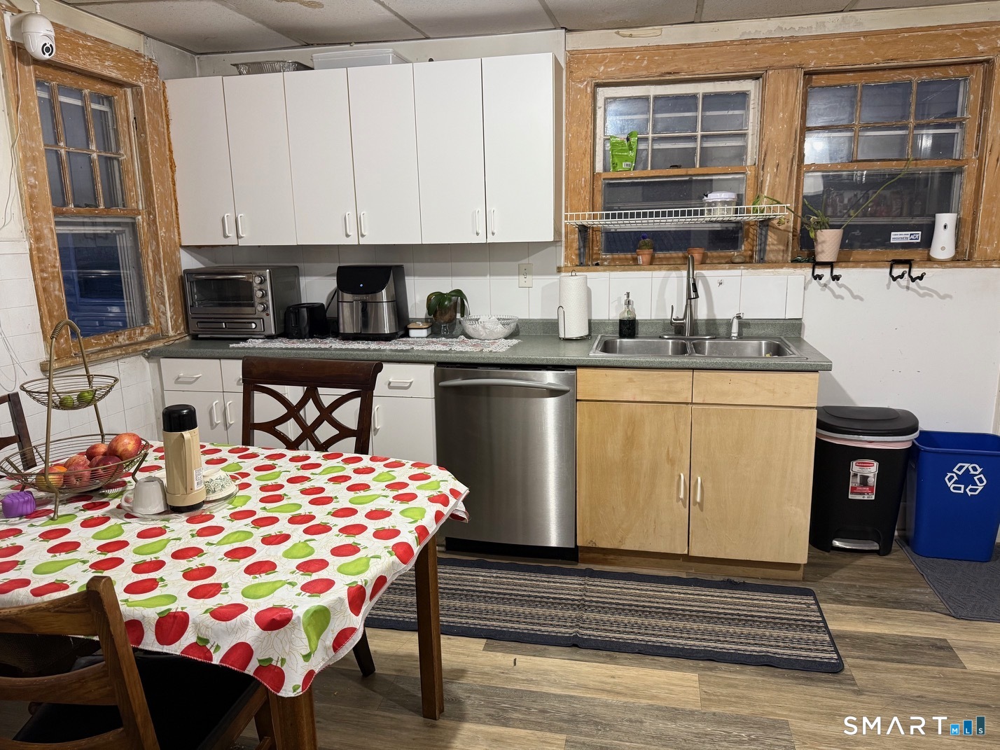 3461 East Main Street Bridgeport, CT 06606 - Photo 7 of 40 a kitchen with stainless steel appliances kitchen island granite countertop a sink and cabinets