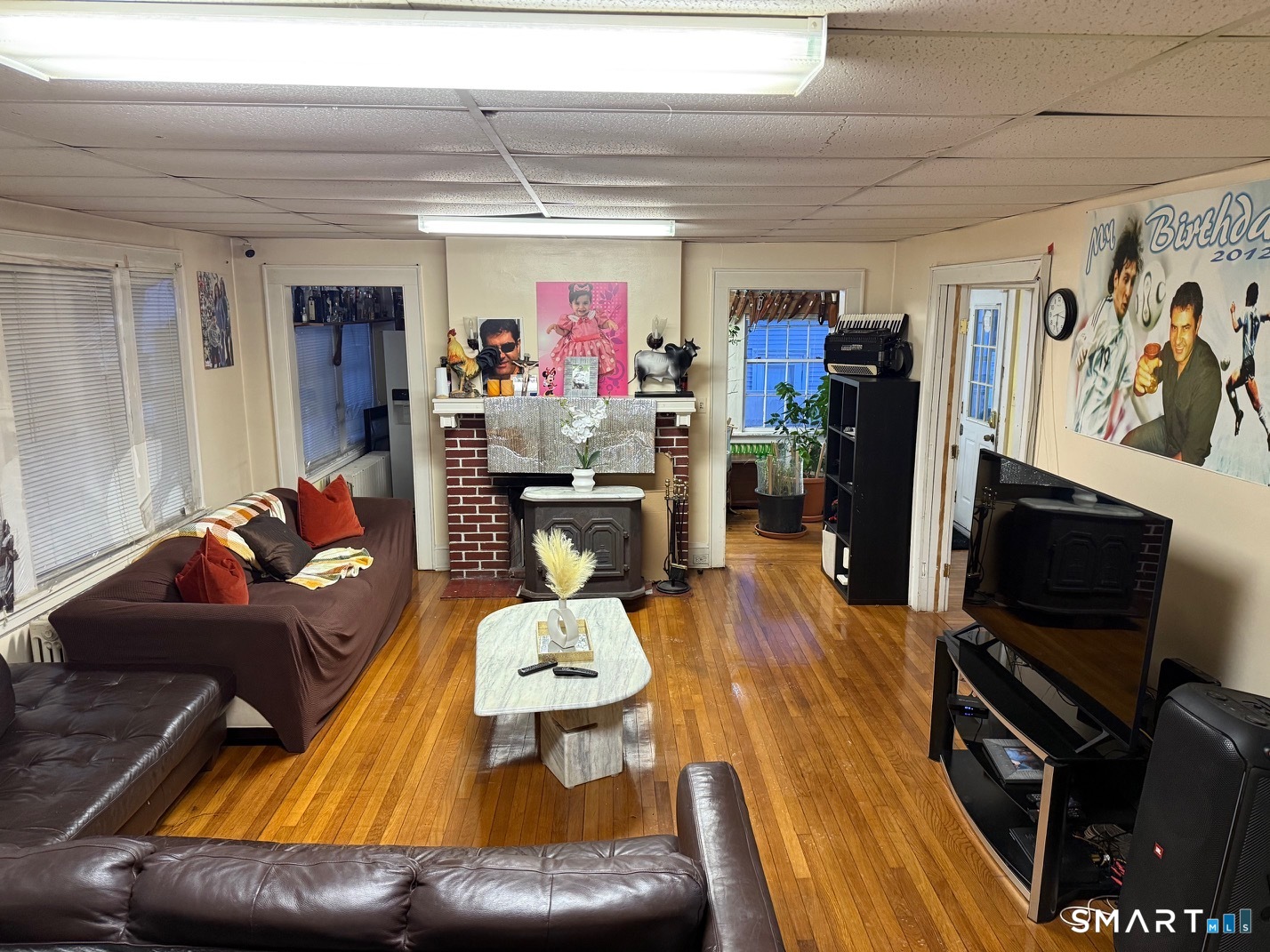 3461 East Main Street Bridgeport, CT 06606 - Photo 10 of 40 a living room with furniture and a flat screen tv