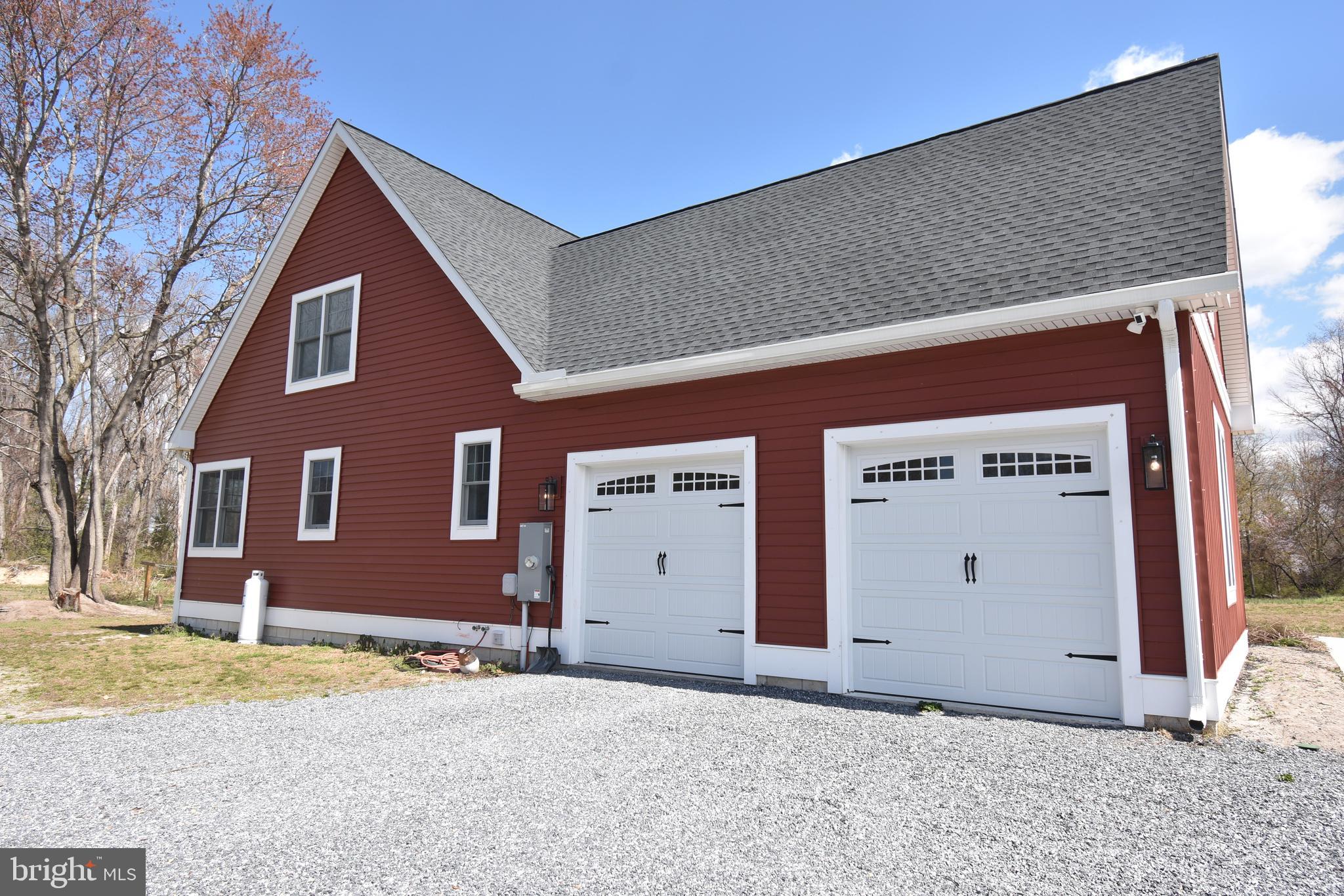 23730 Henry Road Ridgely, MD 21660 - Photo 6 of 28 a front view of a house with a yard