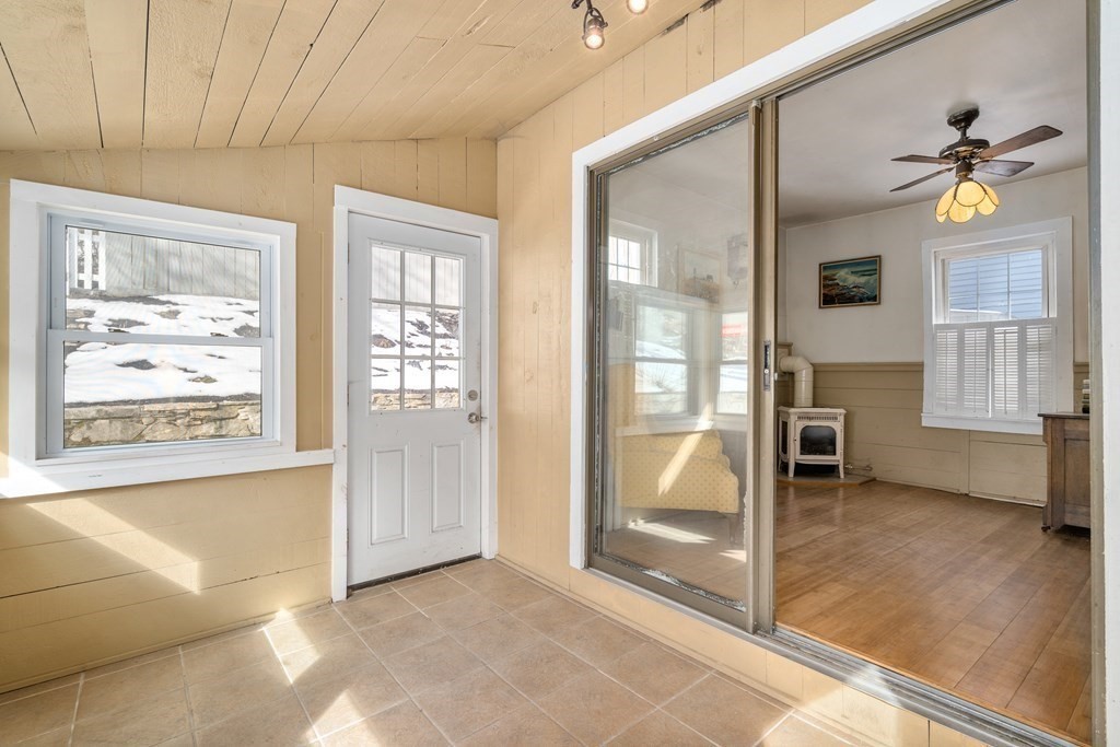 103 Beaconsfield Road Worcester, MA 01602 - Photo 15 of 33 a view of an entryway with wooden floor and a livingroom view