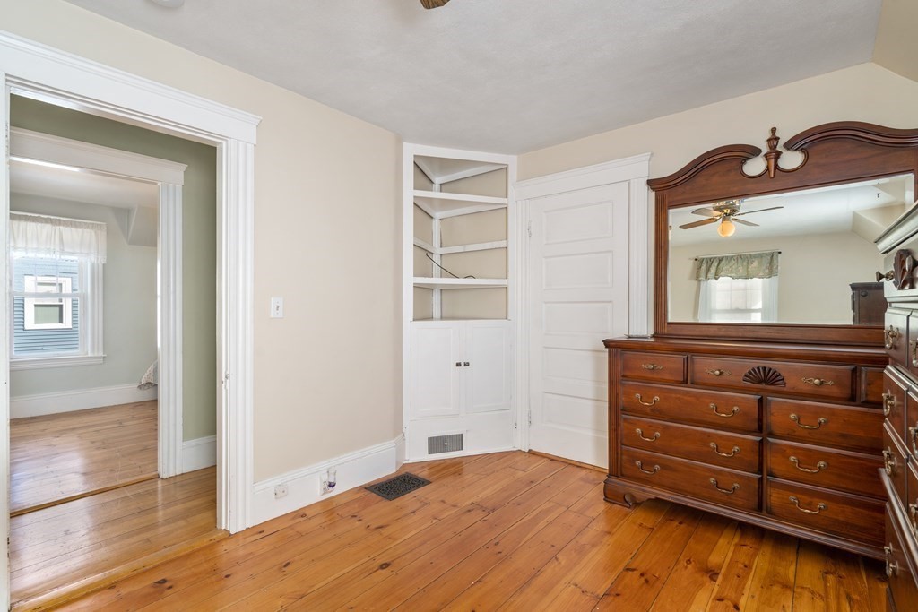 103 Beaconsfield Road Worcester, MA 01602 - Photo 21 of 33 a room with a bed and a mirror on the dresser