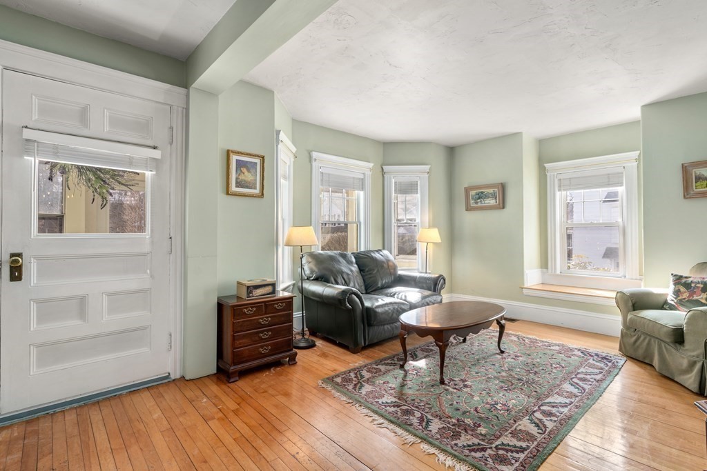 103 Beaconsfield Road Worcester, MA 01602 - Photo 3 of 33 a living room with furniture and a rug