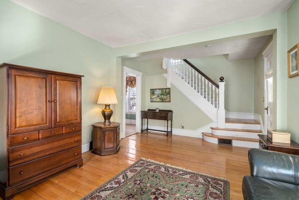 103 Beaconsfield Road Worcester, MA 01602 - Photo 4 of 33 a living room with furniture and a wooden floor