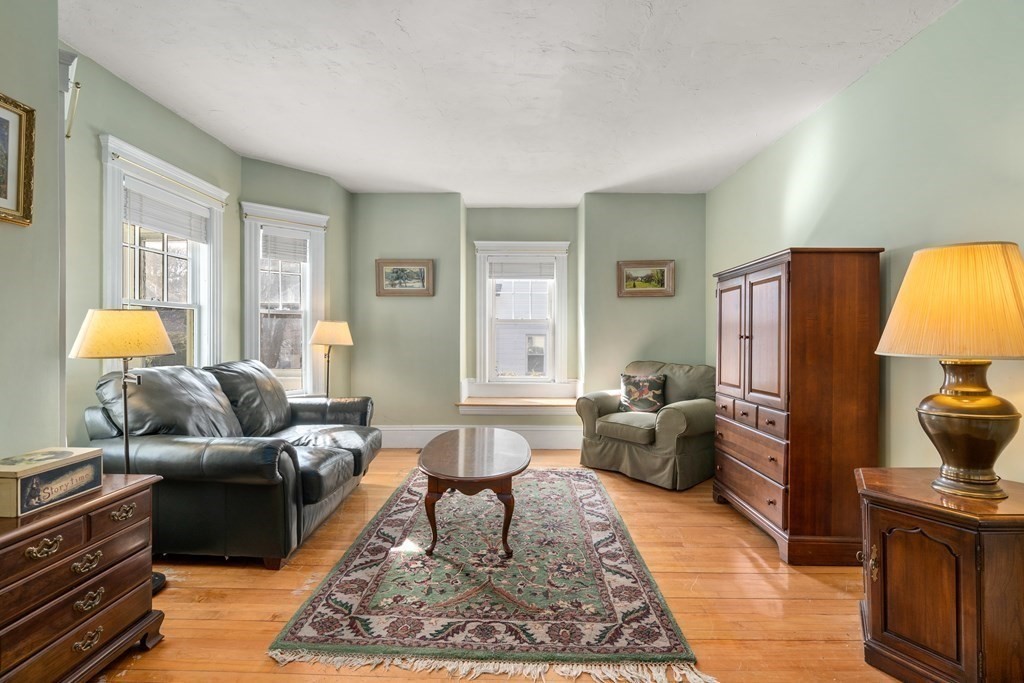 103 Beaconsfield Road Worcester, MA 01602 - Photo 5 of 33 a living room with furniture and a lamp