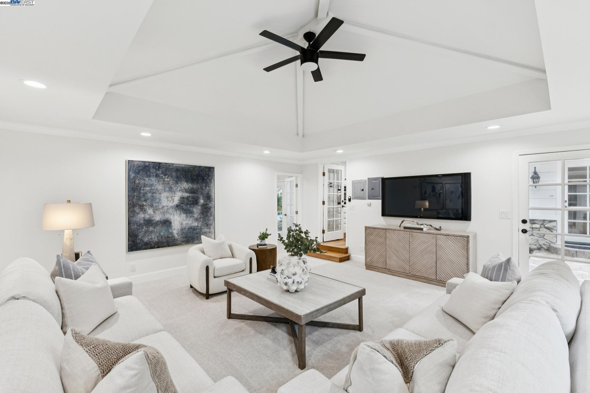55 Cora Court Walnut Creek, CA 94597 - Photo 20 of 60 a living room with furniture a flat screen tv and a window