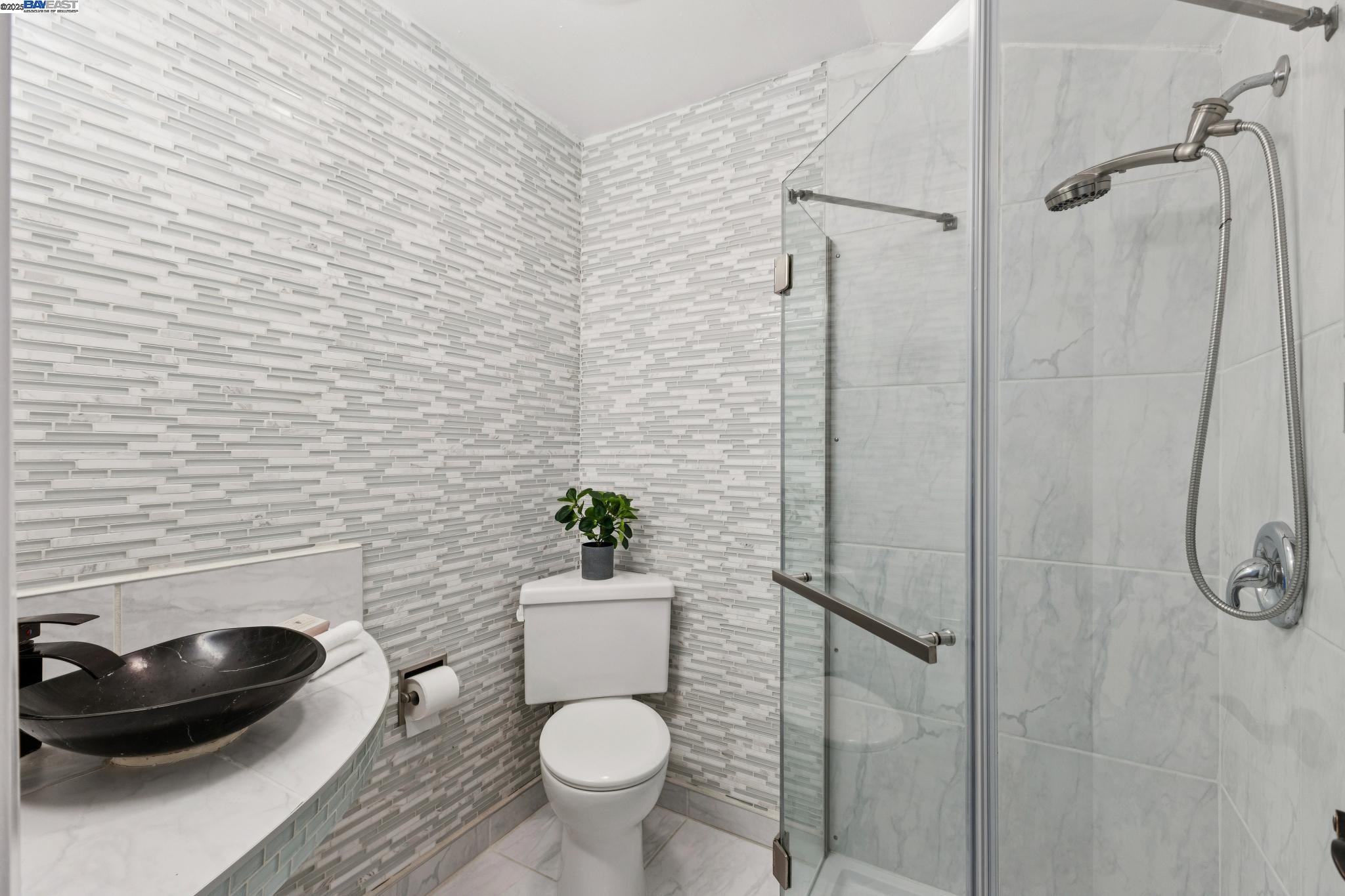 55 Cora Court Walnut Creek, CA 94597 - Photo 34 of 60 a bathroom with a toilet and a sink